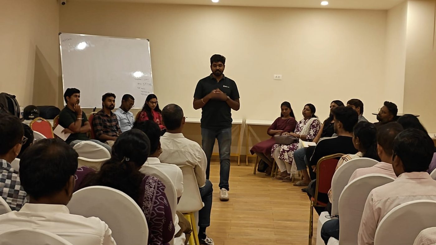 Chanakian addressing a room of seated professionals